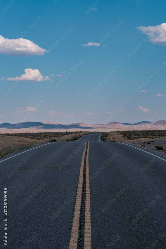Summer clouds over the Highway in the Nevada desert, Nevada, USA Summer clouds over the Highway in the Nevada desert, Nevada, USA