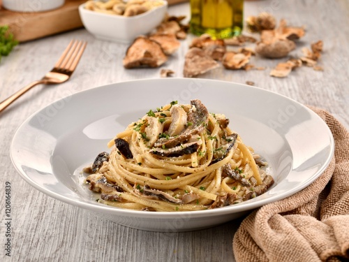 CREAMY TRUFFLE PASTA with mushroom served in dish isolated on wooden table side view of italian fast food