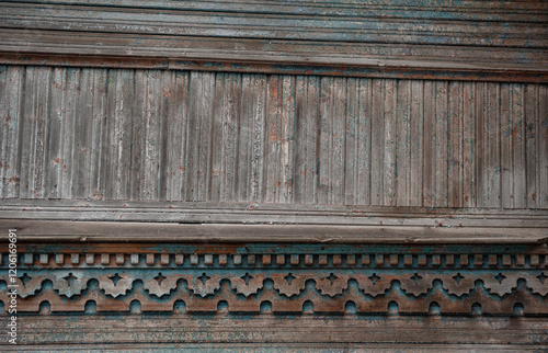 Weathered wooden panel with ornate carving details, perfect for rustic vintage design photo