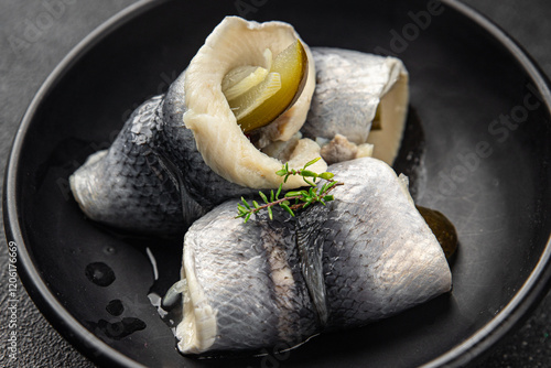 Rollmops herring dish roll onion and pickles appetizer fresh tasty food gourmet food background on the table rustic food top view copy space vegetarian food pescetarian diet