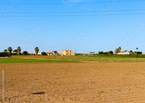 Farmhouse in Countryside. Spanish Farm. Family Villa. Plowing, Rural landscape. Growing fruits, vegetables on farm field. Farm House in Spain village. Finca in countryside. Valencia, Alboraya, L’Horta photo