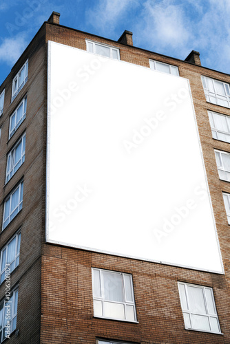Big blank empty billboard on the side of block of flats. Apartment building, mockup with copy space, advertising billboard, commercial housing, real estate. Poster for property marketing, announcement
