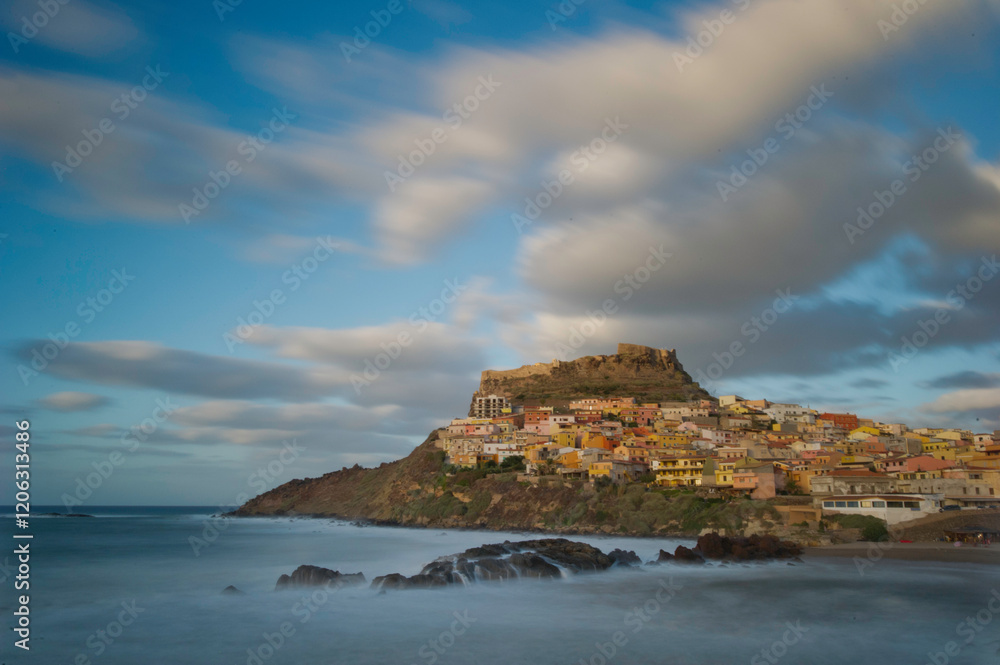 Castelsardo at sunset. Anglona. Sassari. Sardinia, Italy, Long exposure and Motion blur on waves and clouds Castelsardo at sunset. Anglona. Sassari. Sardinia, Italy, Long exposure and Motion blur on waves and clouds