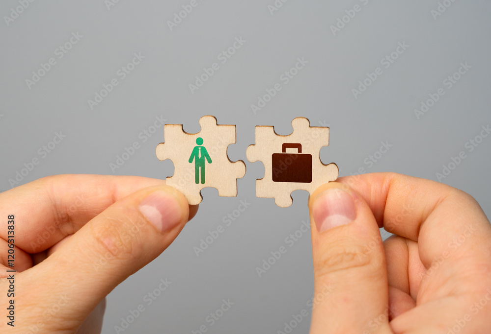 Two puzzles in hands with a symbol of a worker and work in the form of a suitcase. Finding the best job offer. In search of work and earnings. Two puzzles in hands with a symbol of a worker and work in the form of a suitcase. Finding the best job offer. In search of work and earnings.