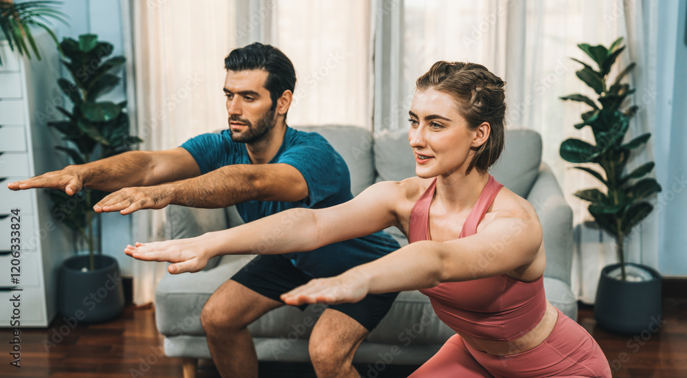 Obraz premium Athletic and sporty couple doing squat together during home body workout exercise session for fit physique and healthy sport lifestyle at home. Gaiety home exercise workout training concept.