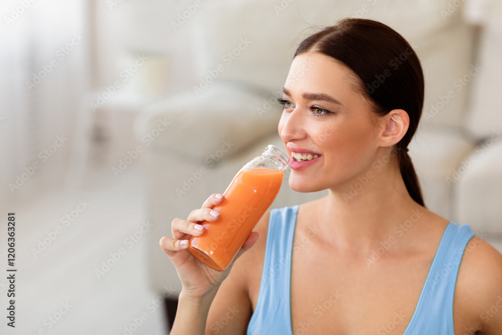 Healthy Lifestyle. Fit Girl Drinking Bottle Of Fruit Juice Losing Weight At Home. Free Space For Text Healthy Lifestyle. Fit Girl Drinking Bottle Of Fruit Juice Losing Weight At Home. Free Space For Text