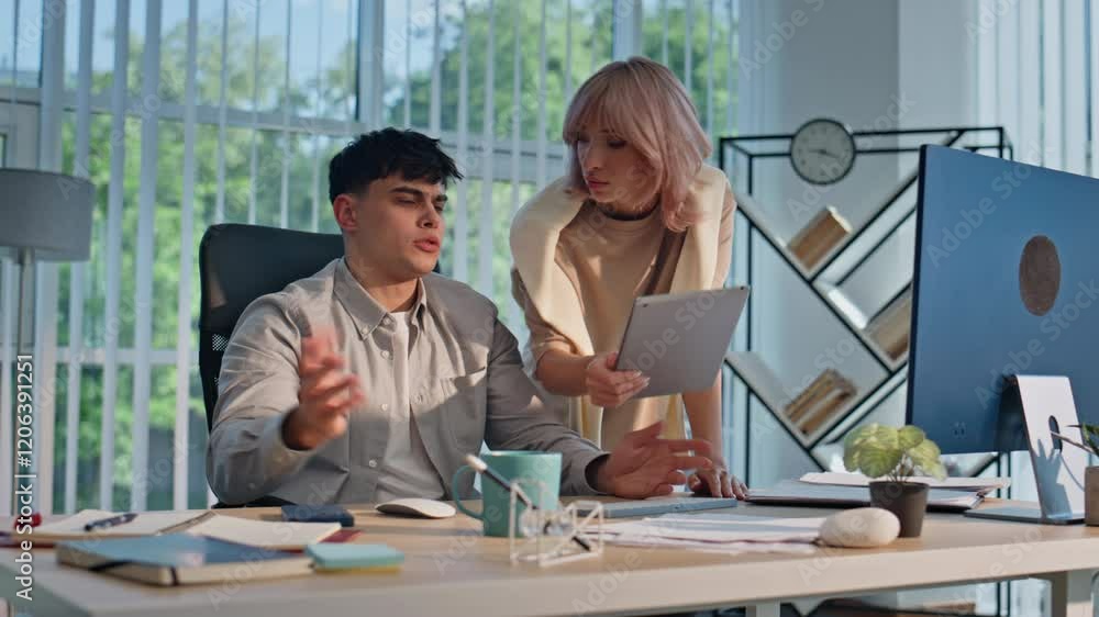 Young businessman working office agency closeup. Woman manager showing tablet Young businessman working office agency closeup. Woman manager showing tablet