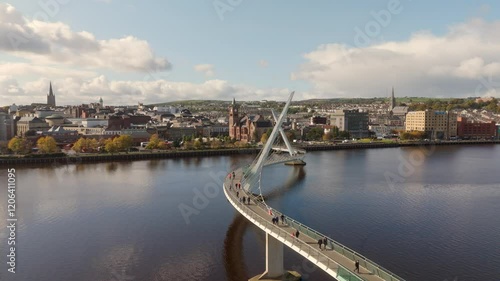 City of Derry aka Londonderry in Northern Ireland aerial view - A Beautiful Cityscape from above by the River Foyle Featuring the Beautiful Pedestrian Peace Bridge