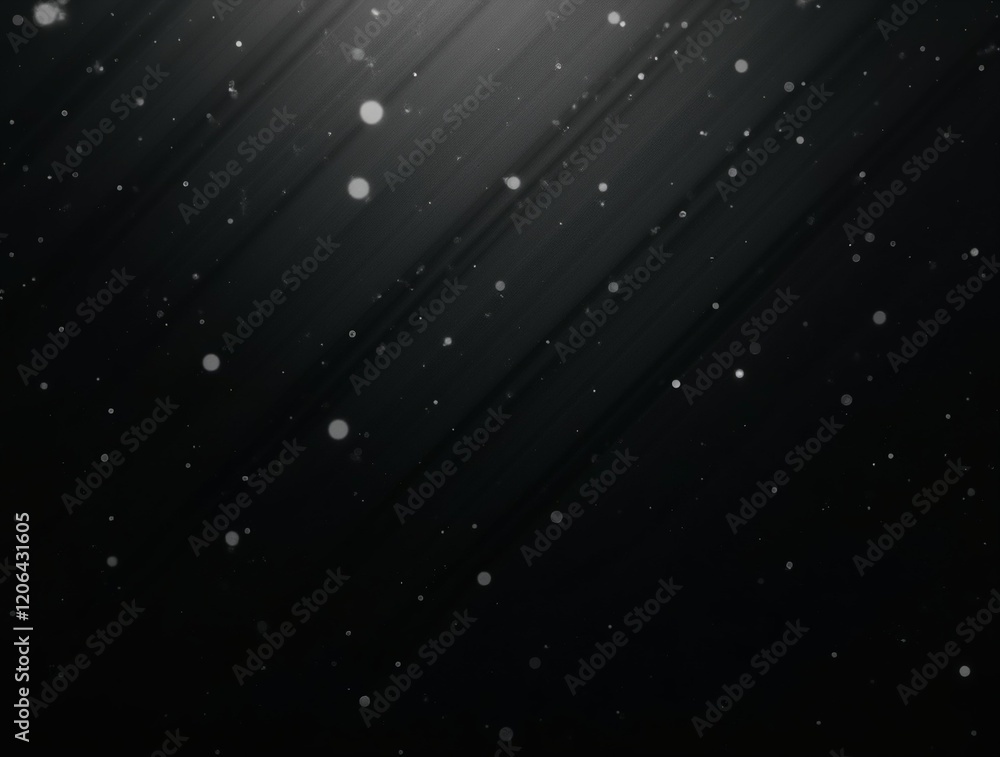 Fototapeta premium Subtle, diffused light illuminates tiny particles suspended in the dark.