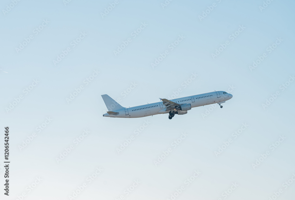 Fototapeta premium White passenger airplane flying in the sky amazing clouds in the background - Travel by air transport at japan, Travel.