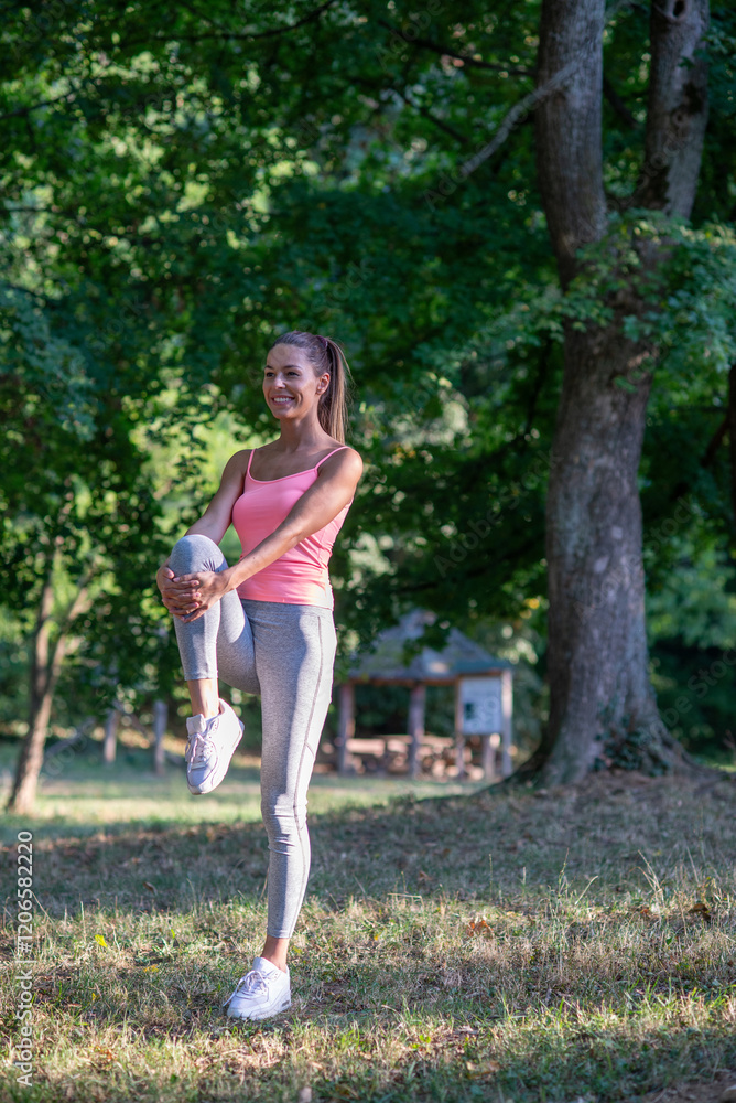 Young woman exercising in the nature in summer Young woman exercising in the nature in summer