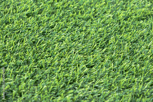 Wallpaper Mural close-up of a lush, green artificial turf. The synthetic blades of grass are perfectly aligned and create a uniform Torontodigital.ca