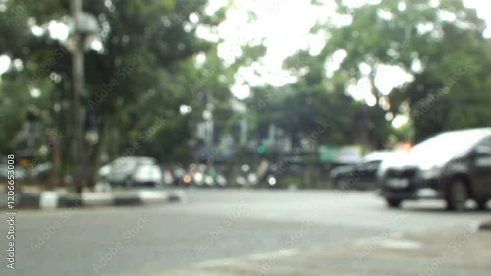 Defocus shot view of a busy traffic at the city. Blured background. Urban transportation, people went to work. Defocus shot view of a busy traffic at the city. Blured background. Urban transportation, people went to work.