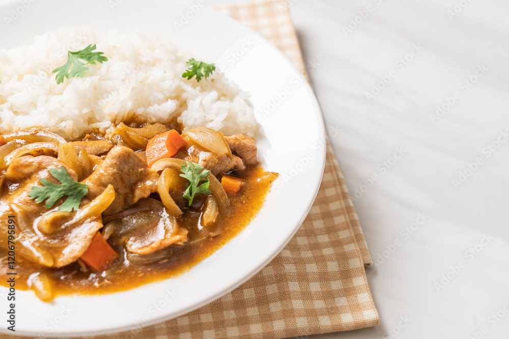 Japanese curry rice with sliced pork, carrot and onions Japanese curry rice with sliced pork, carrot and onions
