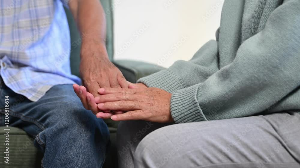 Hands of the old man and a woman hand on the table Hands of the old man and a woman hand on the table