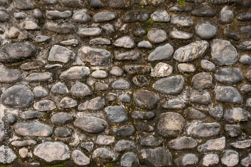 Canvas Print Stone masonry wall featuring textured rock surfaces