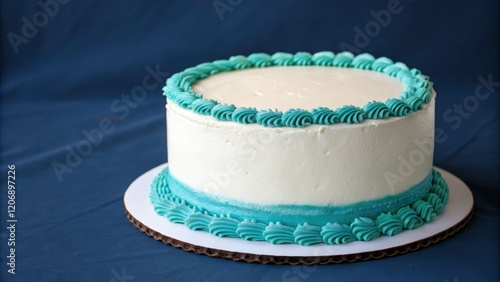 A white happy birthday cake with a teal ganache border on a dark blue background, , , whitecake, happybirthday photo