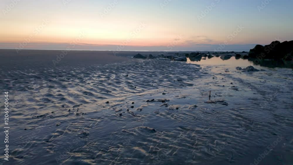 A picturesque and serene beach landscape at sunset, beautifully showcasing gentle waves and a calm horizon A picturesque and serene beach landscape at sunset, beautifully showcasing gentle waves and a calm horizon