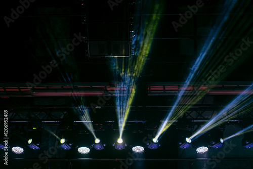 Stage event lights on ceiling of show venue. Led and event beam lighting systems for lighting events photo