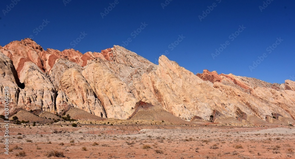 Fototapeta premium the colorful flatiron rock formations in the san rafael reef near uneva canyon on a sunny day, near green river, utah
