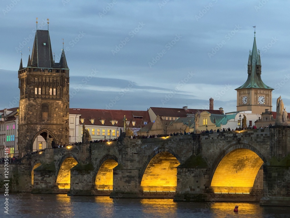 Charles Bridge illuminated at dusk in Prague. Charles Bridge illuminated at dusk in Prague.