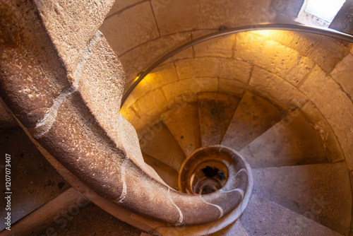 Photography Stone spiral staircase winding downwards in barcelona cathedral