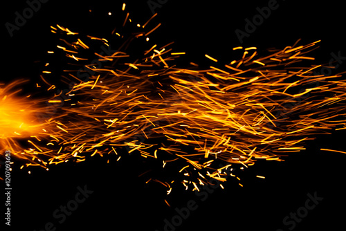 sparks from the fire glowing in the dark