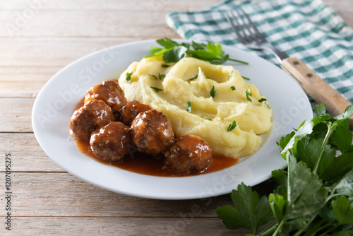 Foto Meatballs with mashed potatoes on wooden table