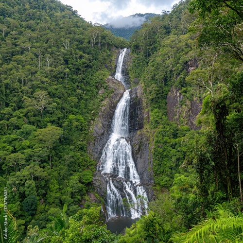 Majestic Waterfall Cascading Through Lush Tropical Rainforest