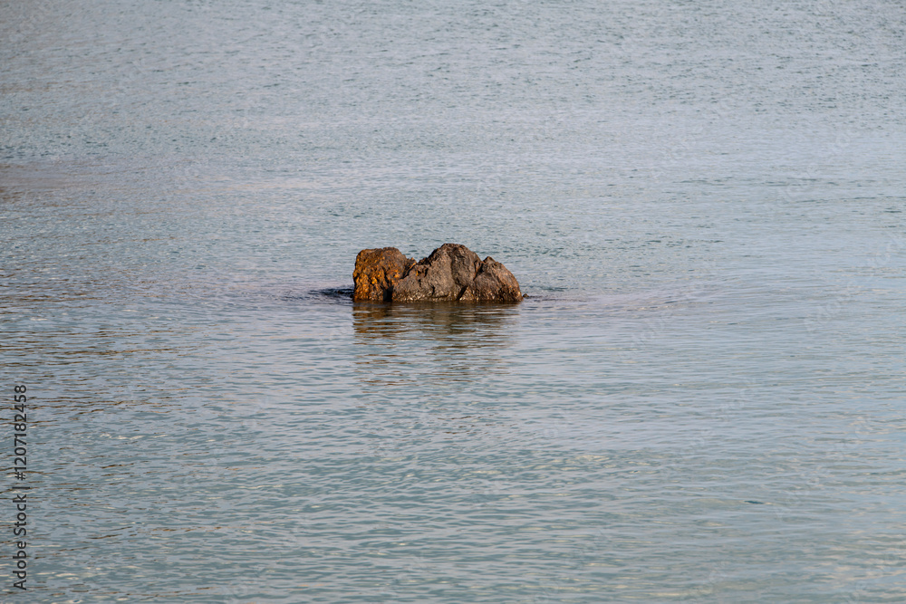 Fototapeta premium small rock on the sea