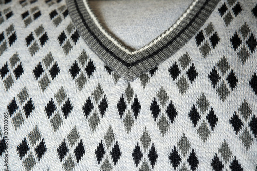 Textured knitwear showcasing elegant argyle pattern in neutral tones photo