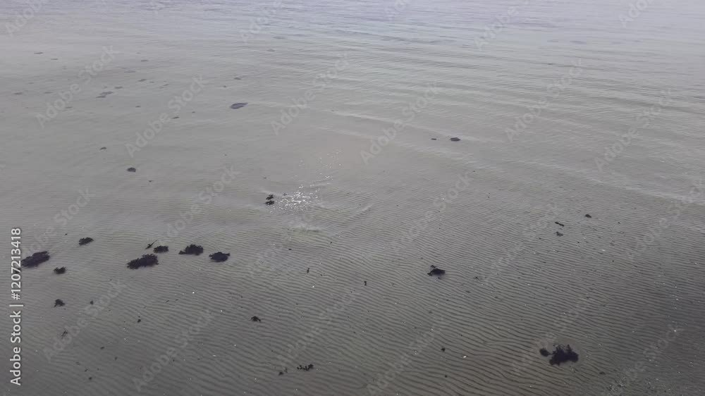 Aerial view of small waves on shallow sandbar Aerial view of small waves on shallow sandbar