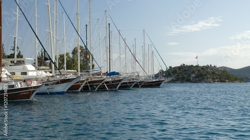 Gulets and Green island in the holiday town of Bozburun. Mediterranean village in Turkey. Marmaris district, Mugla province, Turkey country photo