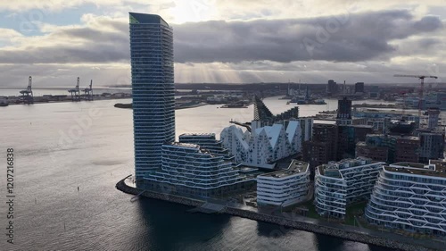 Aerial reveal of Aarhus Docklands and Harbor Apartment Buildings and Town photo