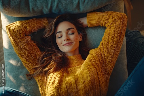 A relaxed and cheerful mid-aged woman reclines on the sofa in her welcoming home after finishing her time at the office. Stock photo