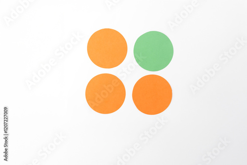 four circular shapes arranged on a white background. Three of the circles are orange, and one circle is green. step in creative project photo