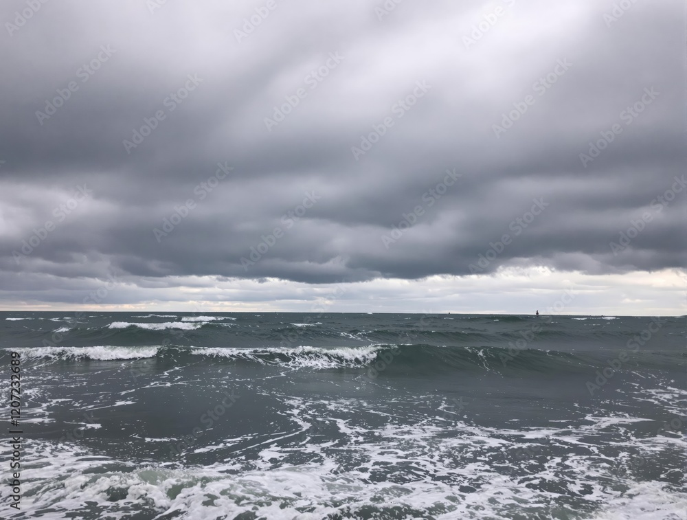 Stormy Ocean Waves Crashing on Shore Under Dark Cloudscape Stormy Ocean Waves Crashing on Shore Under Dark Cloudscape