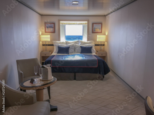 Obraz na płótnie Luxurious oceanview outside or exterior ocean view cabin stateroom on luxury ocean cruiseship or cruise ship liner in modern interior design with king queen double bed w salonie
