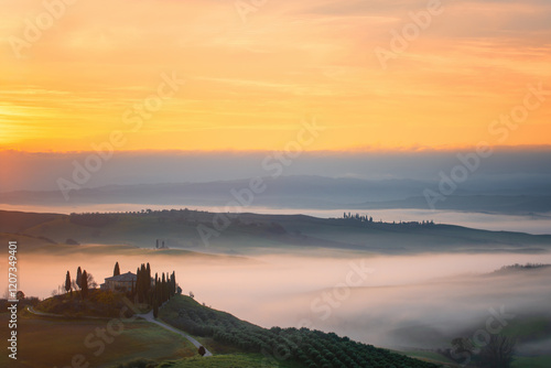 Sunrise over a traditional house in Val d Orcia, Tuscany photo