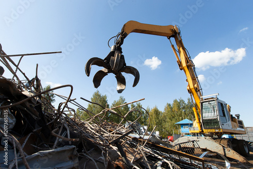 Excavator for loading scrap metal.