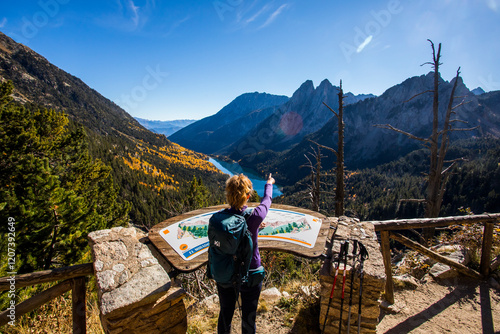 Young hiker woman in autumn in Aiguestortes and Sant Maurici National Park, Spain photo