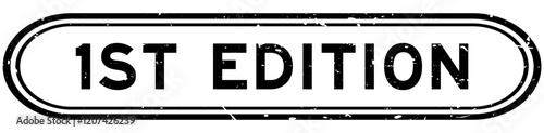 Grunge black first edition word rubber seal stamp on white background