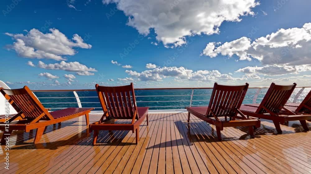 Deck chairs overlooking the ocean on a sunny day, relaxation and travel concept Deck chairs overlooking the ocean on a sunny day, relaxation and travel concept