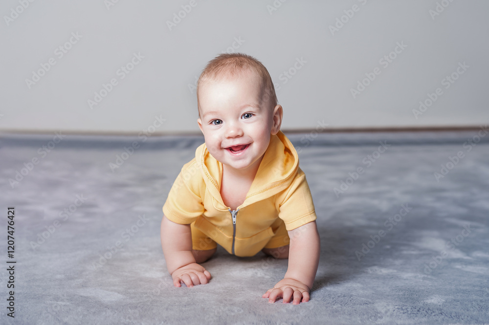 Smiling Baby in a Yellow Outfit Crawling on the Floor Smiling Baby in a Yellow Outfit Crawling on the Floor