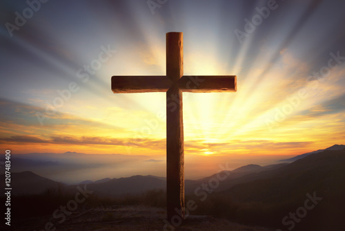 Wooden crucifix in a mountain landscape at sunset
