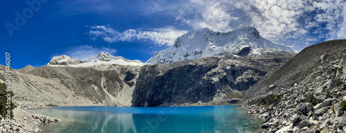 Peru, panoramic view of scenic Laguna 69 lake in Huascaran National Park, snowcapped peruvian mountains Andes, Cordyliera Blanca photo