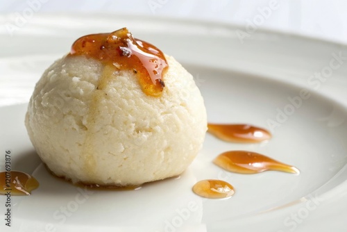 Close-up of a single rosogolla with a dollop of syrup on top, syrup, bengali dessert, dumpling, indian sweets photo