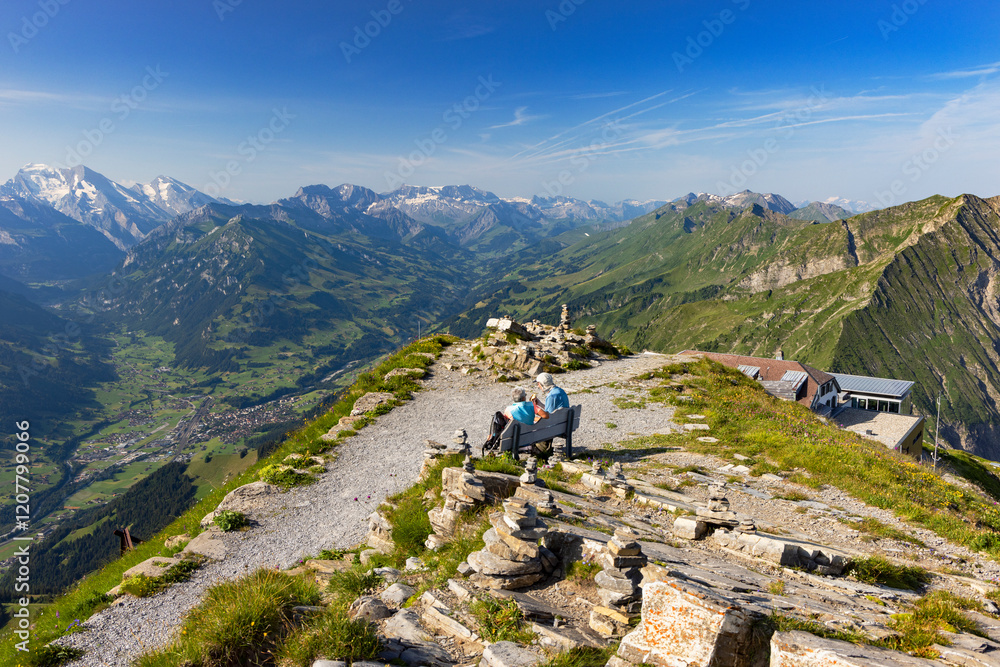 Couple at peak of Niesen mountain, Canton of Bern, Switzerland Couple at peak of Niesen mountain, Canton of Bern, Switzerland