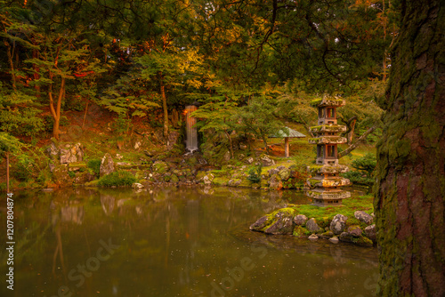 View of Hisago-ike Pond, Kaiseki Pagoda and waterfall in Kenrokumachi Japanese Garden, Kanazawa City, Ishikawa Prefecture, Honshu, Japan photo