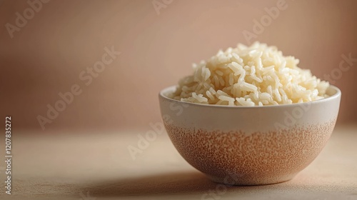 Perfectly cooked white rice served in a textured bowl on a marble countertop